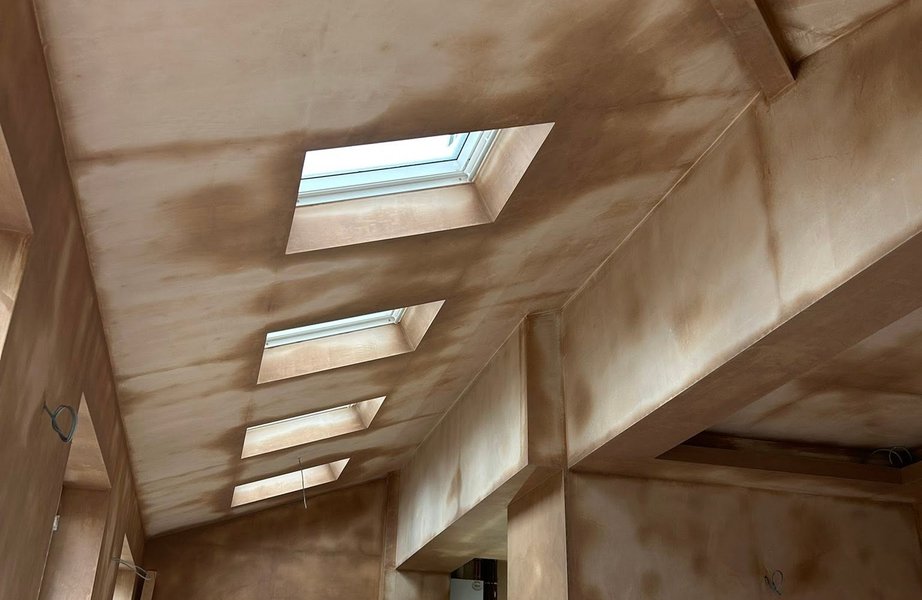 Plastering work across an interior with rooflights