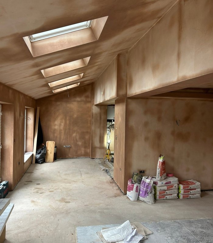 Plastered room with rooflights