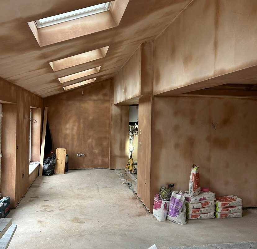 Plastered walls and ceiling in a room with rooflights