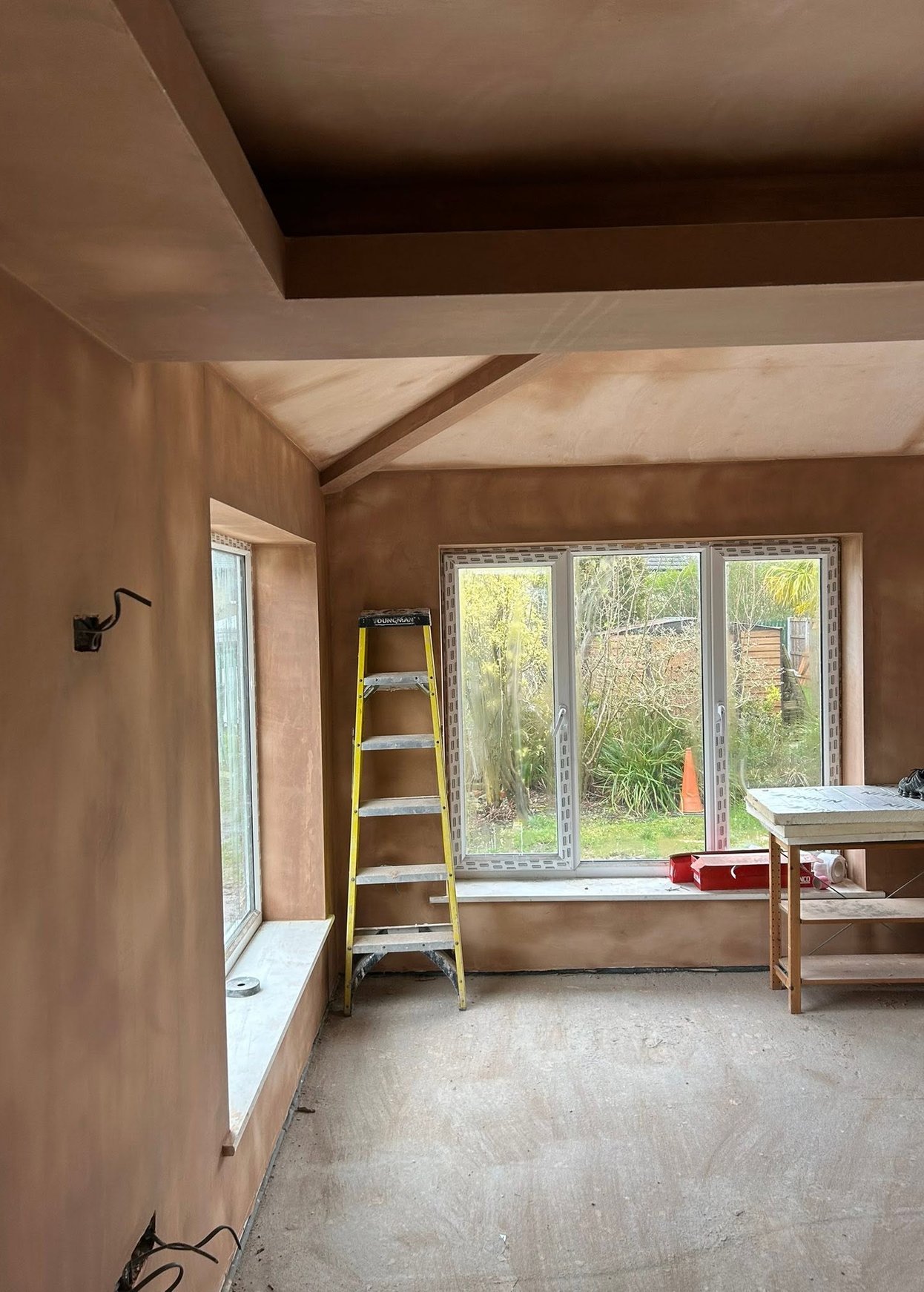 Freshly plastered walls and ceiling in an interior room