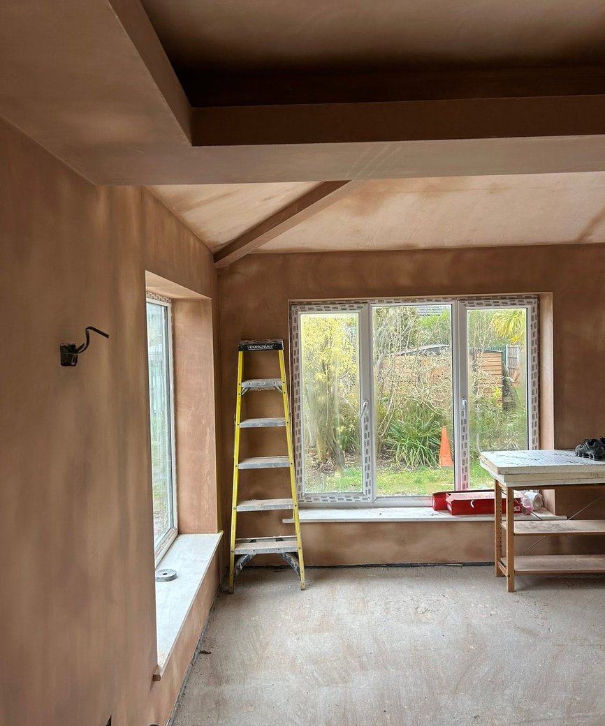 Freshly plastered walls and ceiling in an interior room